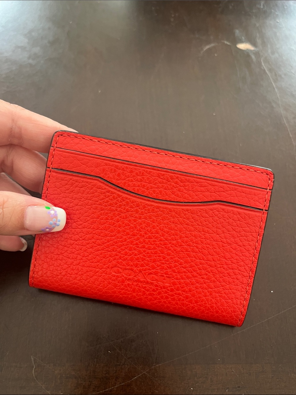 Coach Bright Red Pebbled Leather Card Holder with magnetic closure